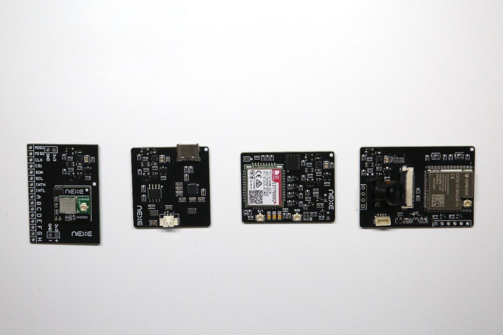 NEXE Micro, Power, Cellular, and AI camera modules in a row on a white surface